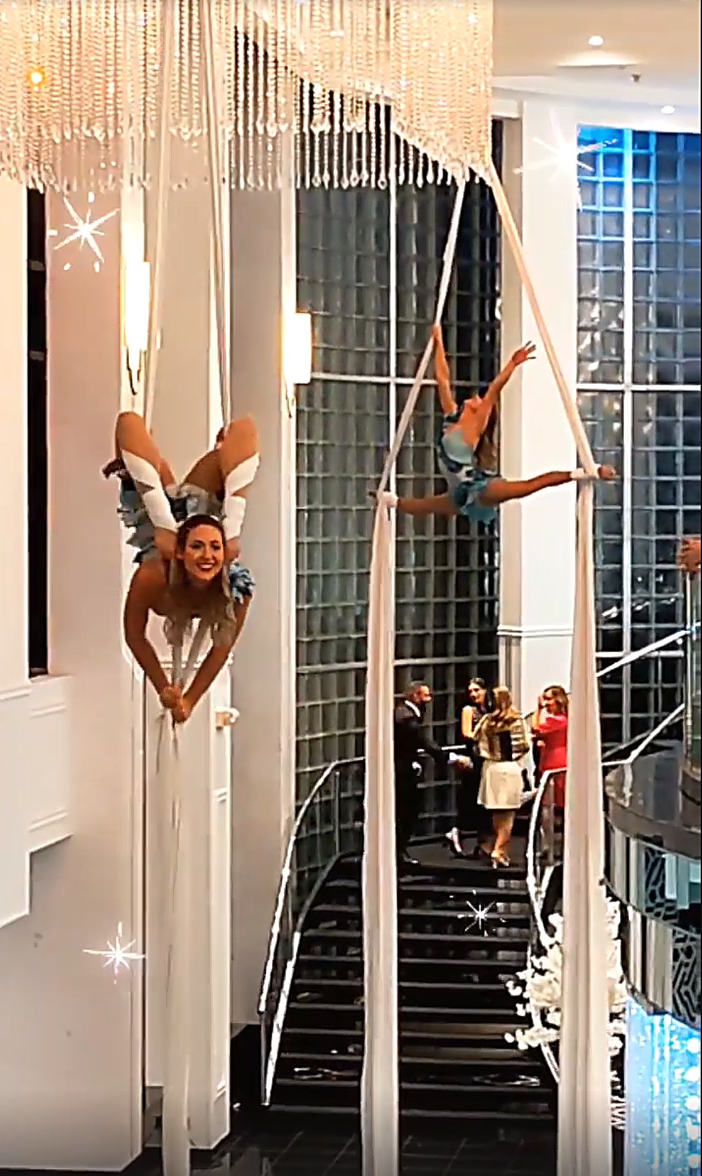 Aerial silks duo performance in an elegant hotel lobby